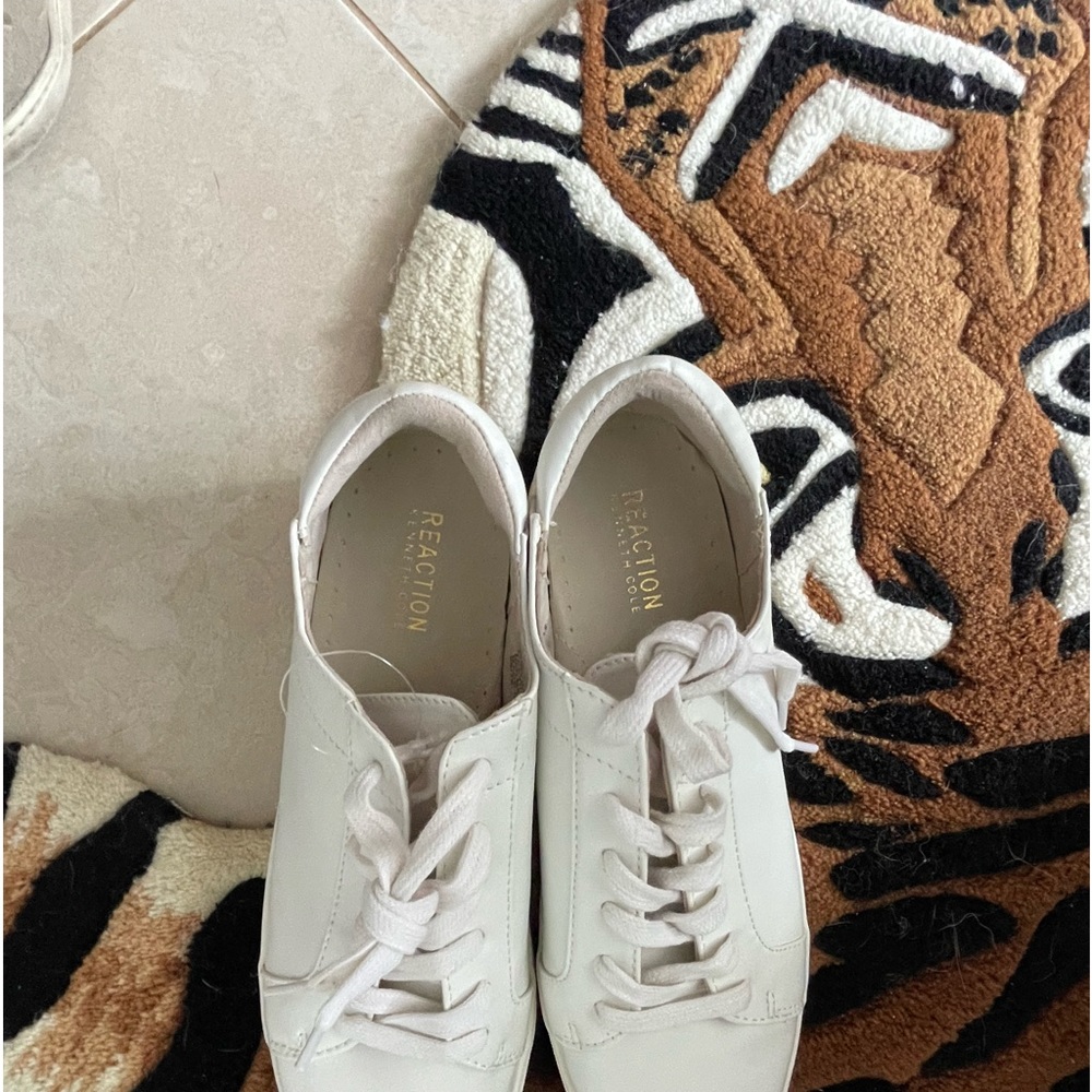 Brand new white sneakers.